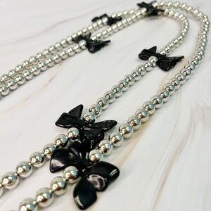 NWT Ellison Silver crossbody phone lanyard with Black Bow Accents